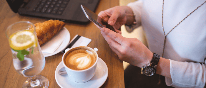 man taking photo of his coffee