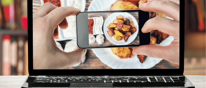 person taking photo of his food