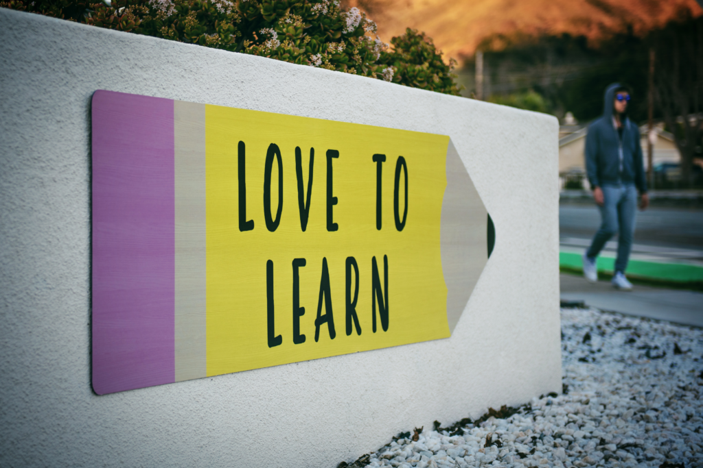 The words " Love to Learn" painted on a wall