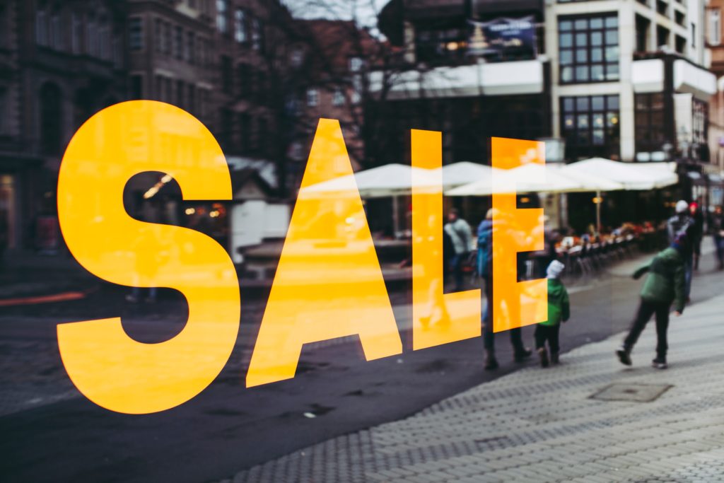 A shop window with the word: "Sale" written on it