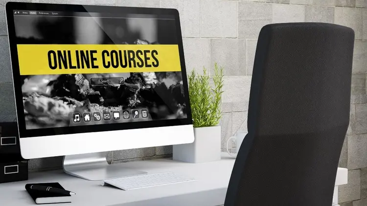 A desk top computer with the words 'online courses' on the screen.