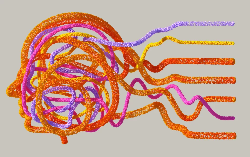 A creative picture of a person's head with brightly colored ribbons.