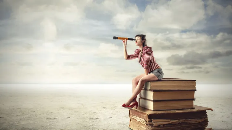 A drawing of a woman at the beach, sitting on top of a stack of books and looking through a telescope. 