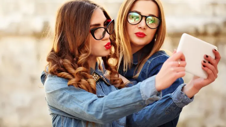 Two women taking a selfie.