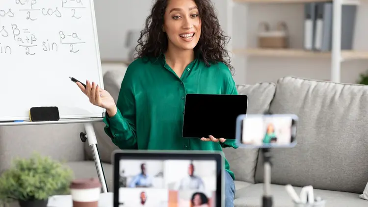 A lady busy teaching an online course.