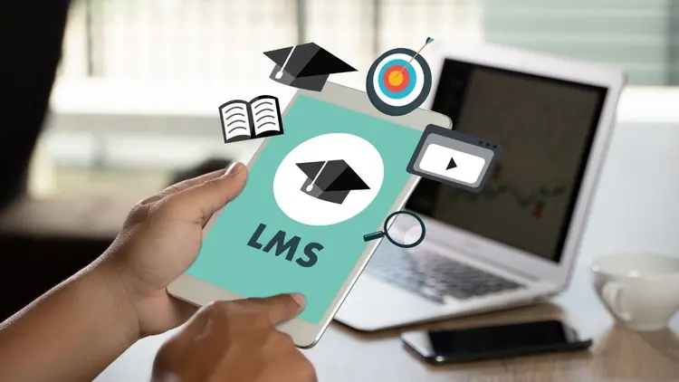 A person holding a tablet with the graphic depicting an LMS (Learning Management System). 