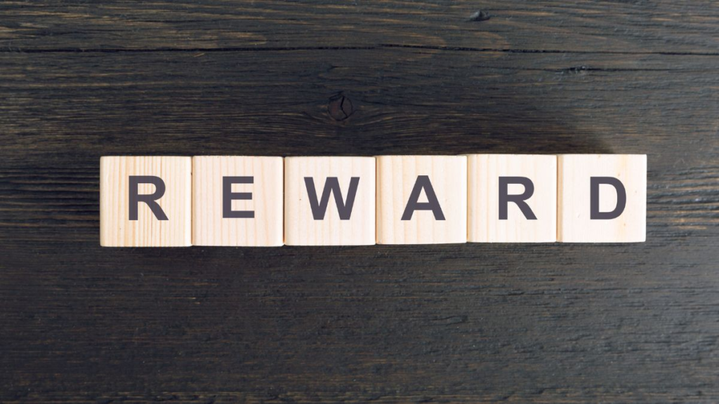 Letter blocks spelling the word "Reward".