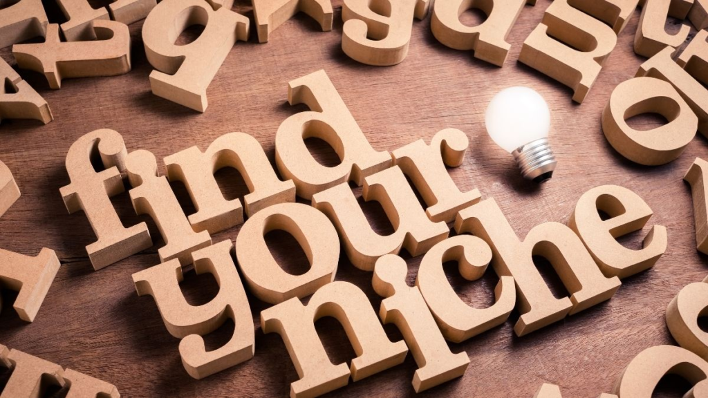 Wooden craft  letters spelling out the words: "Find Your Niche"