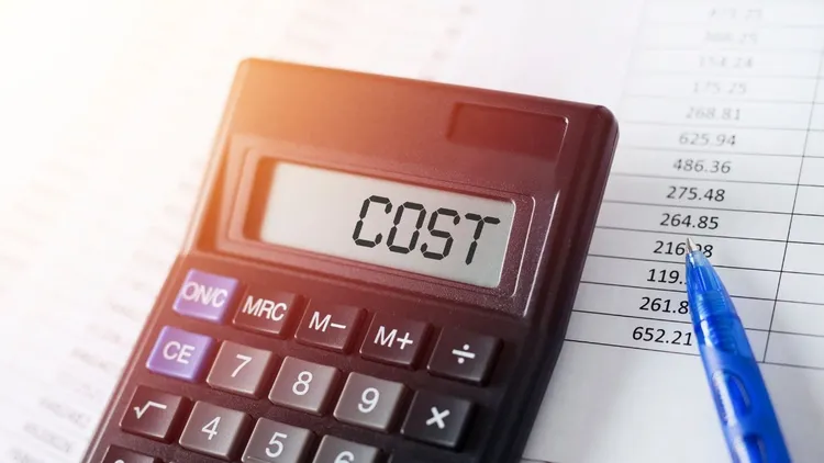 A calculator with the word "cost" on the screen.