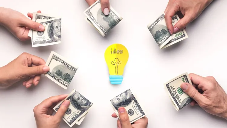 A graphic depicting crowdfunding: People holding out notes with a lightbulb in the centre. 