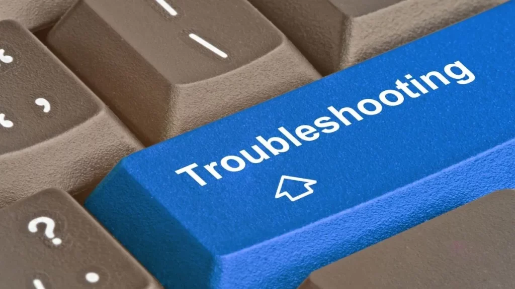 A computer keyboard with the word "troubleshoot" on one of the keys.