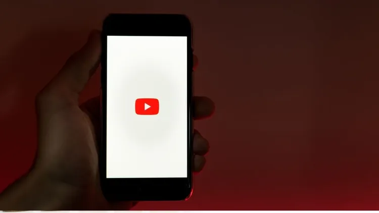 A cellphone screen with the Youtube logo on it.