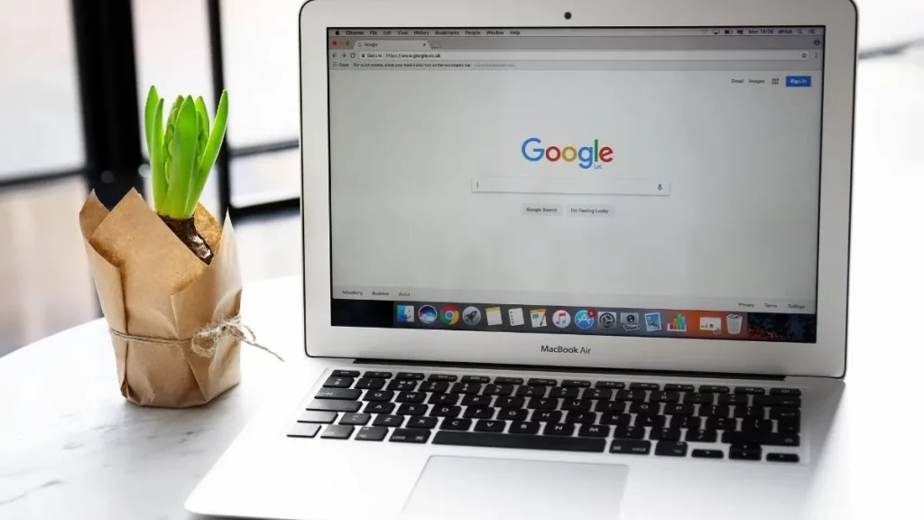 A laptop with the Google search screen open.
