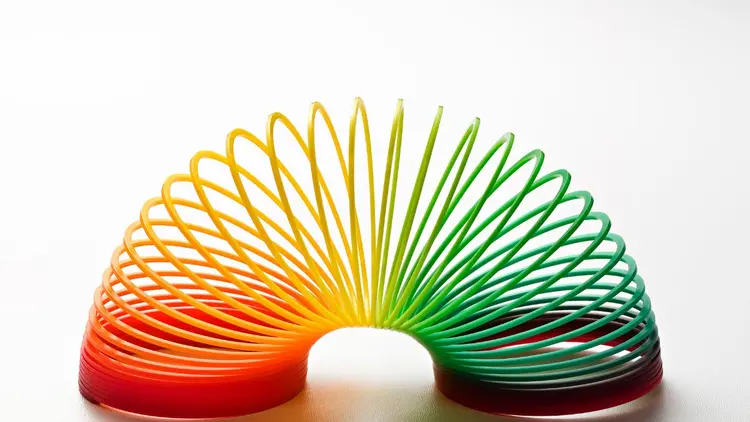 A multicolored slinky, depicting flexibility.