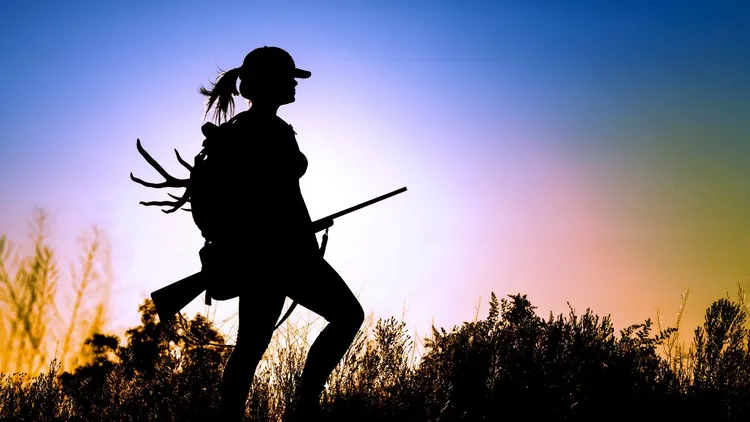 A lady going hunting at dawn.