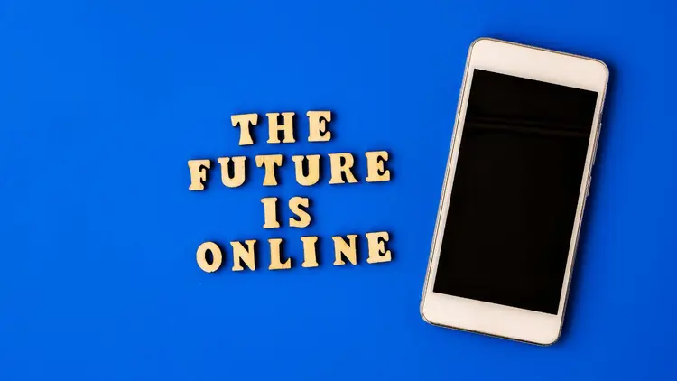 A cellphone next to the words: The future is online"