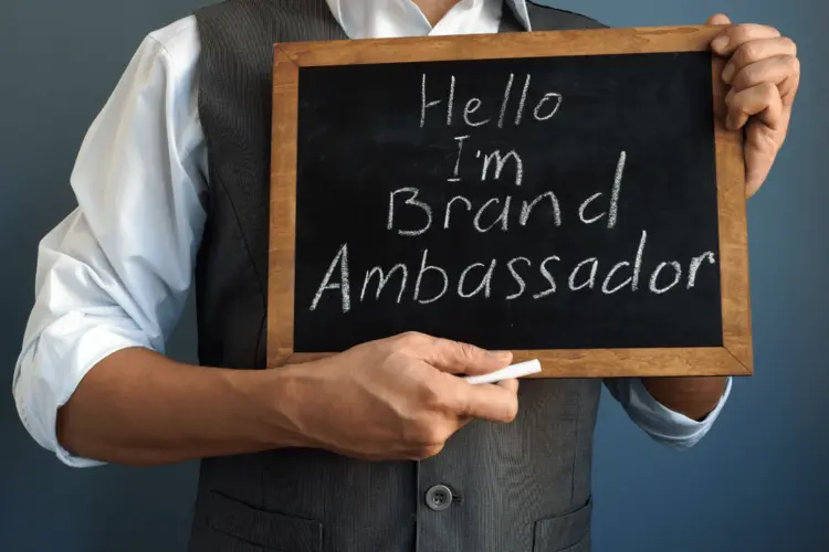 A brand ambassador with a chalkboard.