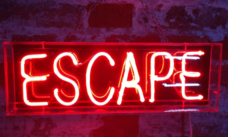The word "Escape" as a neon light sign.