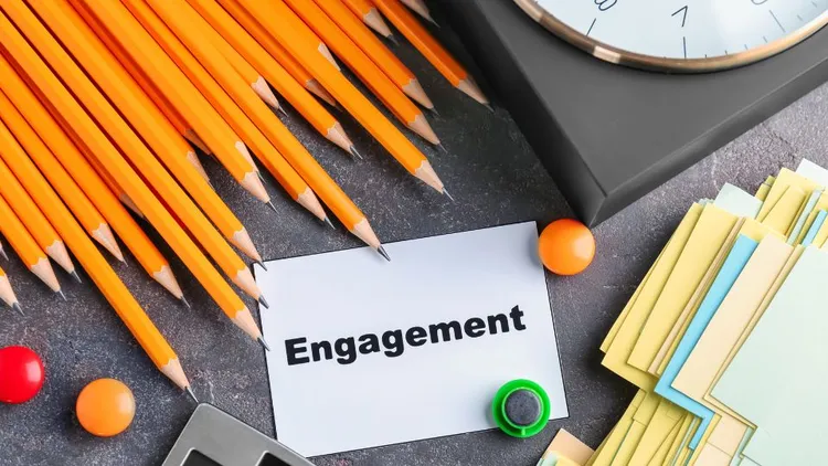 A sticky note with the word "engagement" on it. 