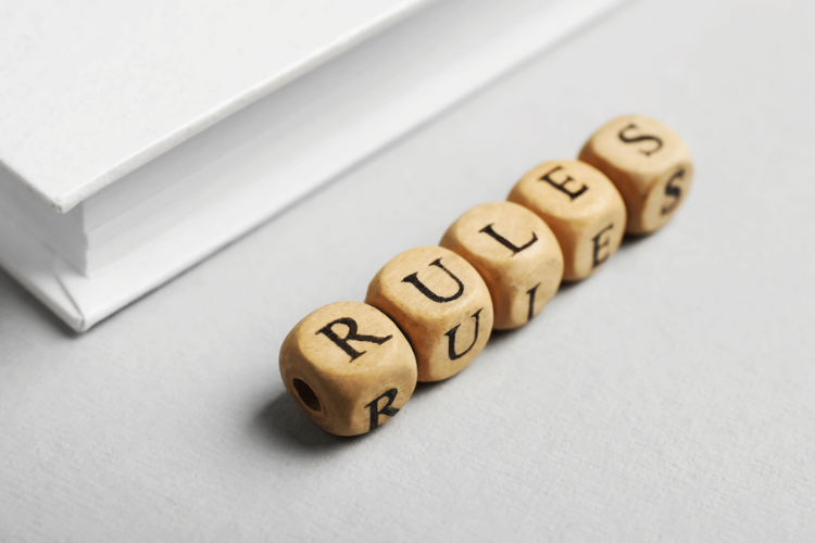 Letter cubes spelling out the word "rules".