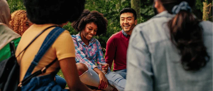 diverse group engaging in outdoor discussion